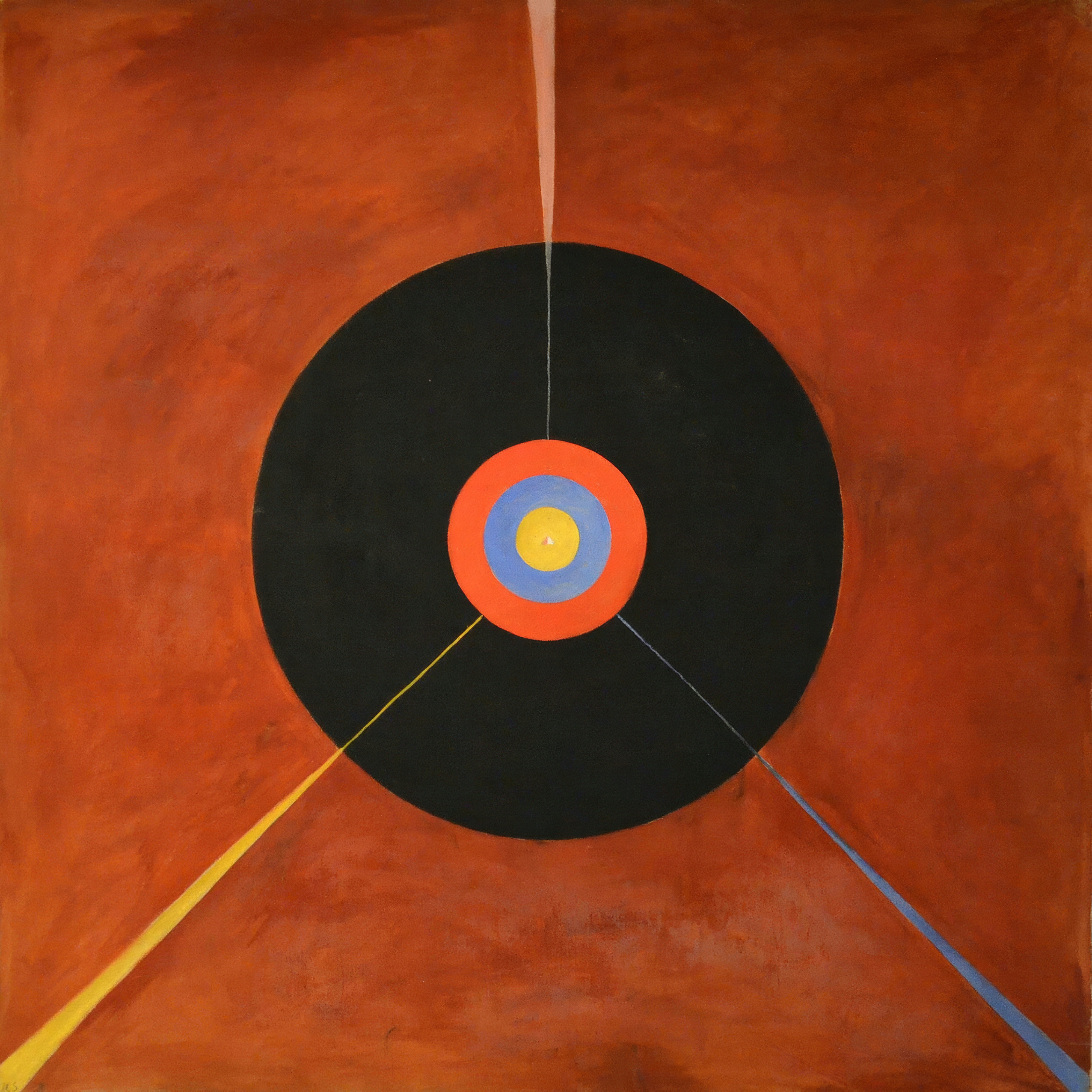 A black disc with a small blue, orange and pink target at its centre sits on a deep red ground, with fine rays crossing it.