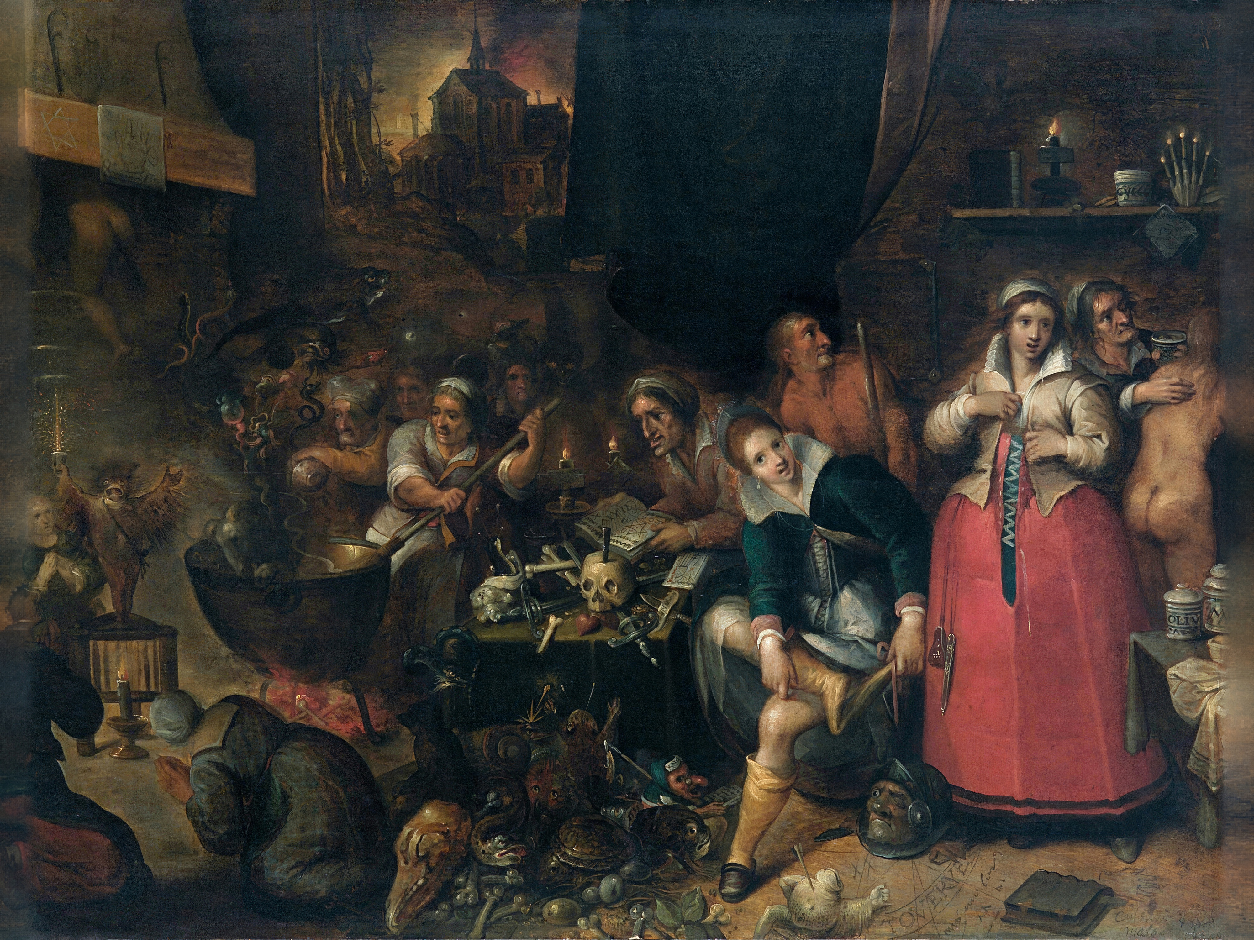 Witches crowd round a cauldron and a table of skulls and books while a young woman in red waits by candlelight.