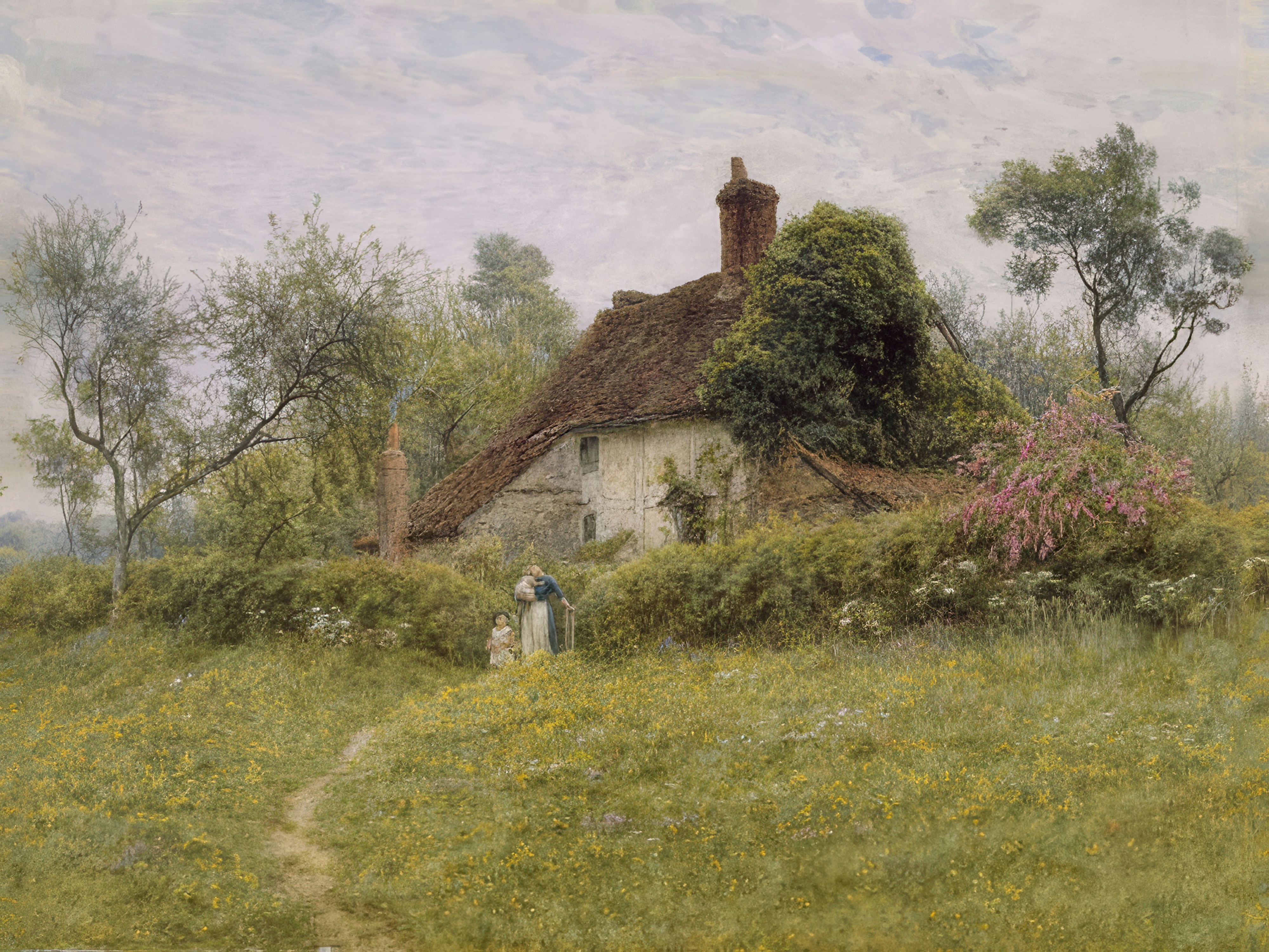 A path through a meadow of yellow flowers leads to an old thatched cottage.