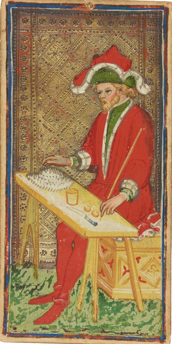 The Magician, a painted trump of the Visconti–Sforza tarot: a man in a red robe and a wide hat seated at a table laid with a cup, coins and a knife, on a tooled gold ground.