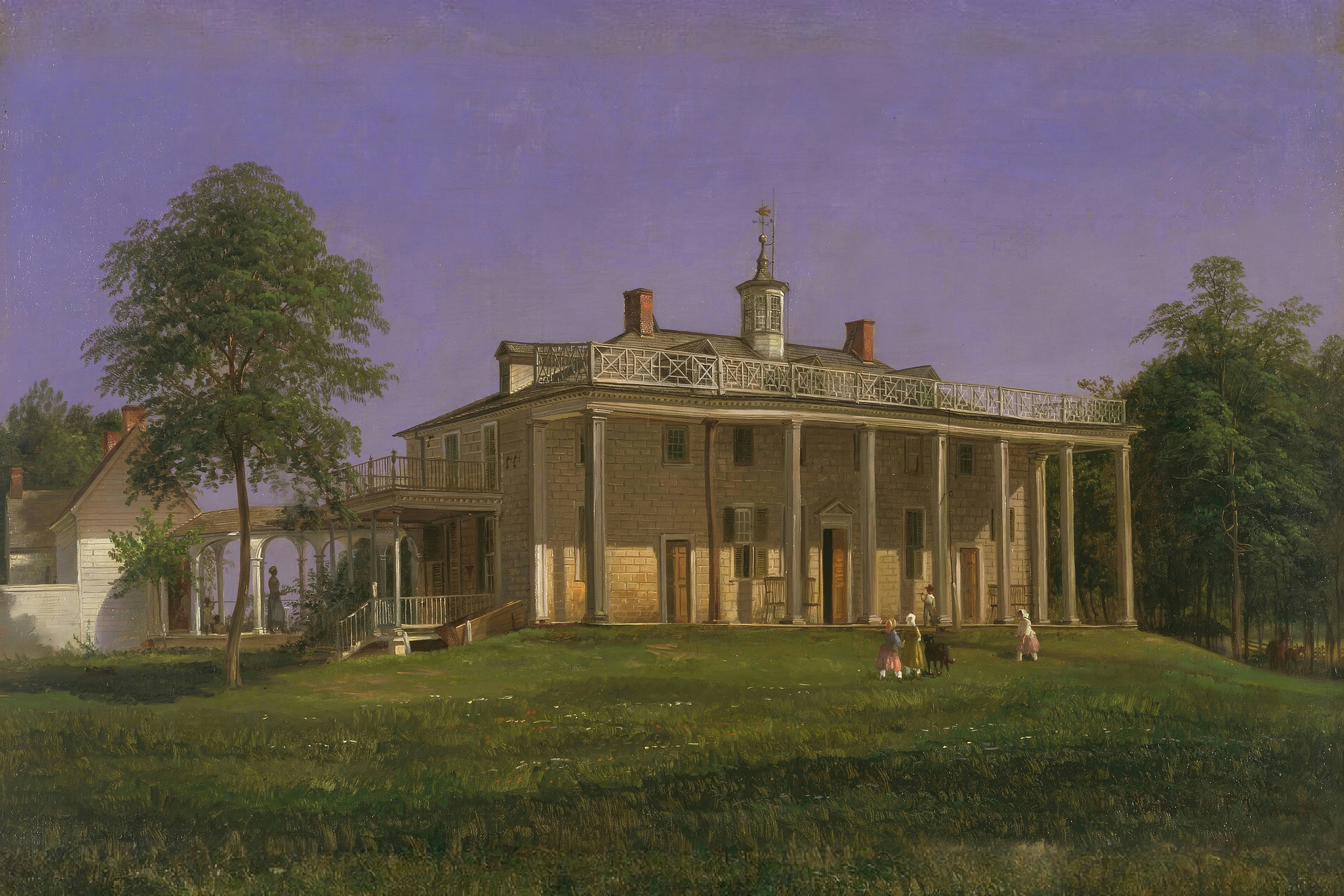 Mount Vernon stands on its lawn under a violet twilight sky.