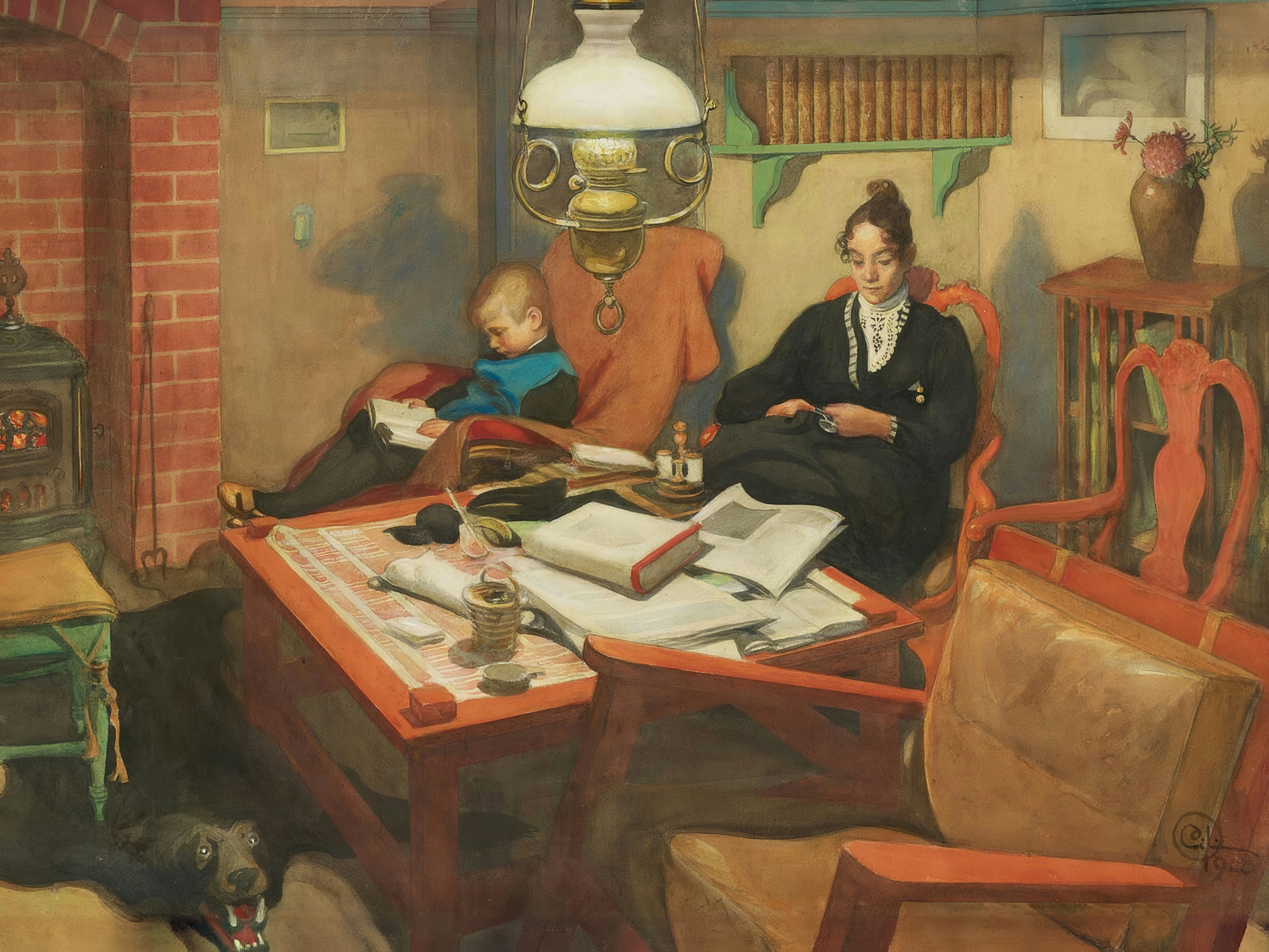A mother sews and a boy reads by the light of a hanging lamp.