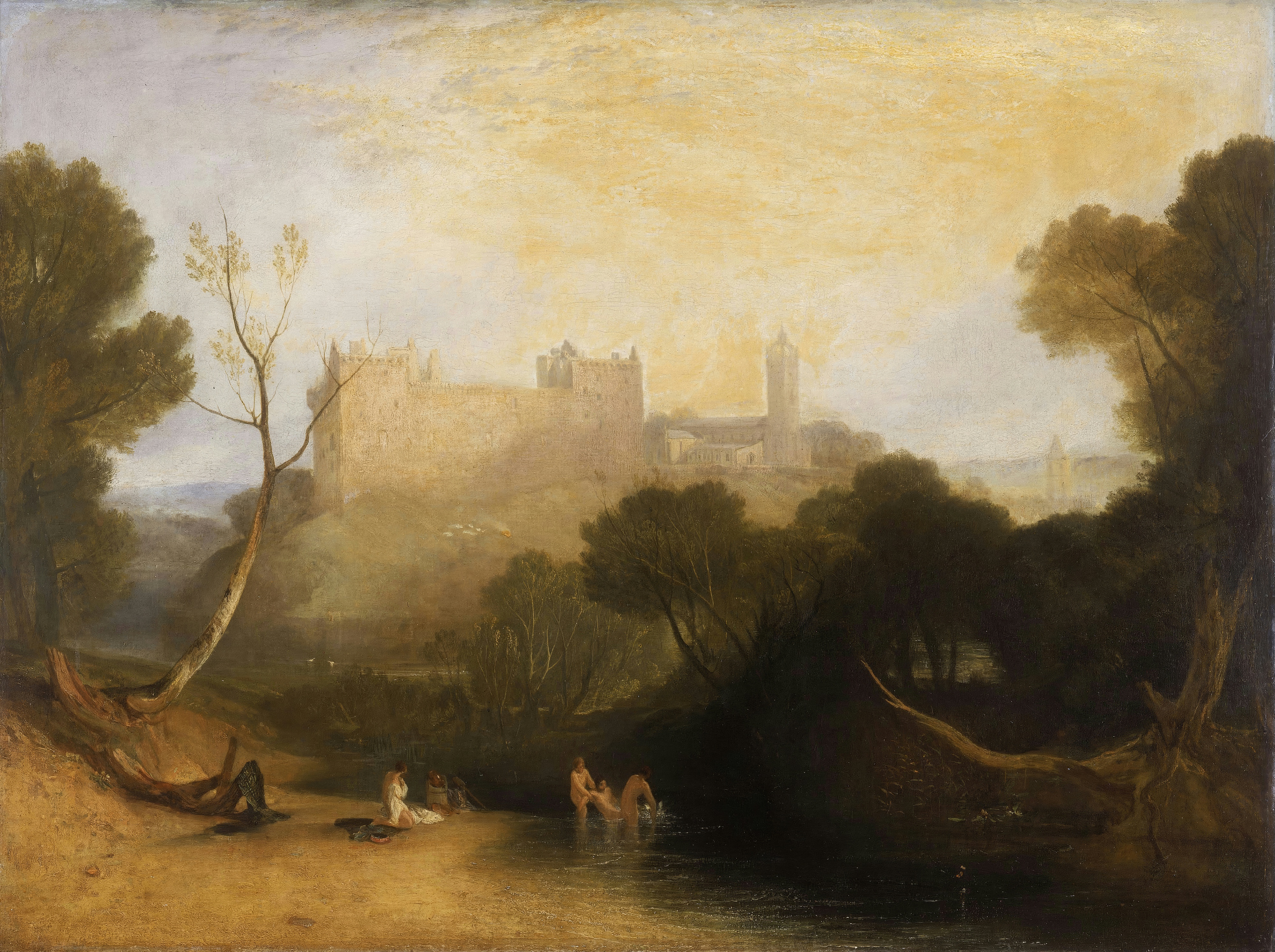 A ruined palace on a hill above a lake, framed by dark trees in warm golden light.