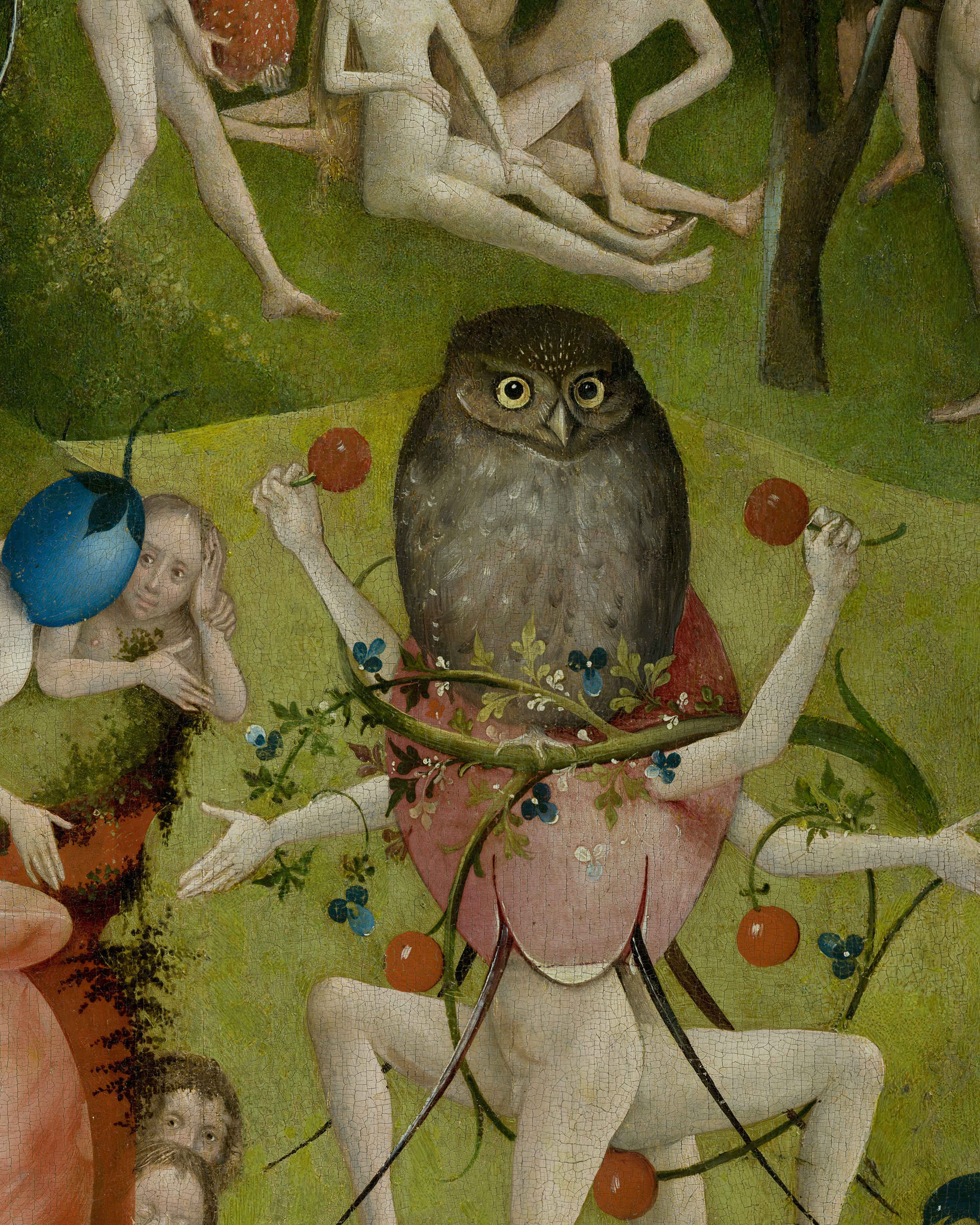 A large brown owl perched on a pale figure wrapped in a pink flower bud, its arms outstretched holding red berries, in the green garden of pleasures; detail of Bosch's Garden of Earthly Delights.
