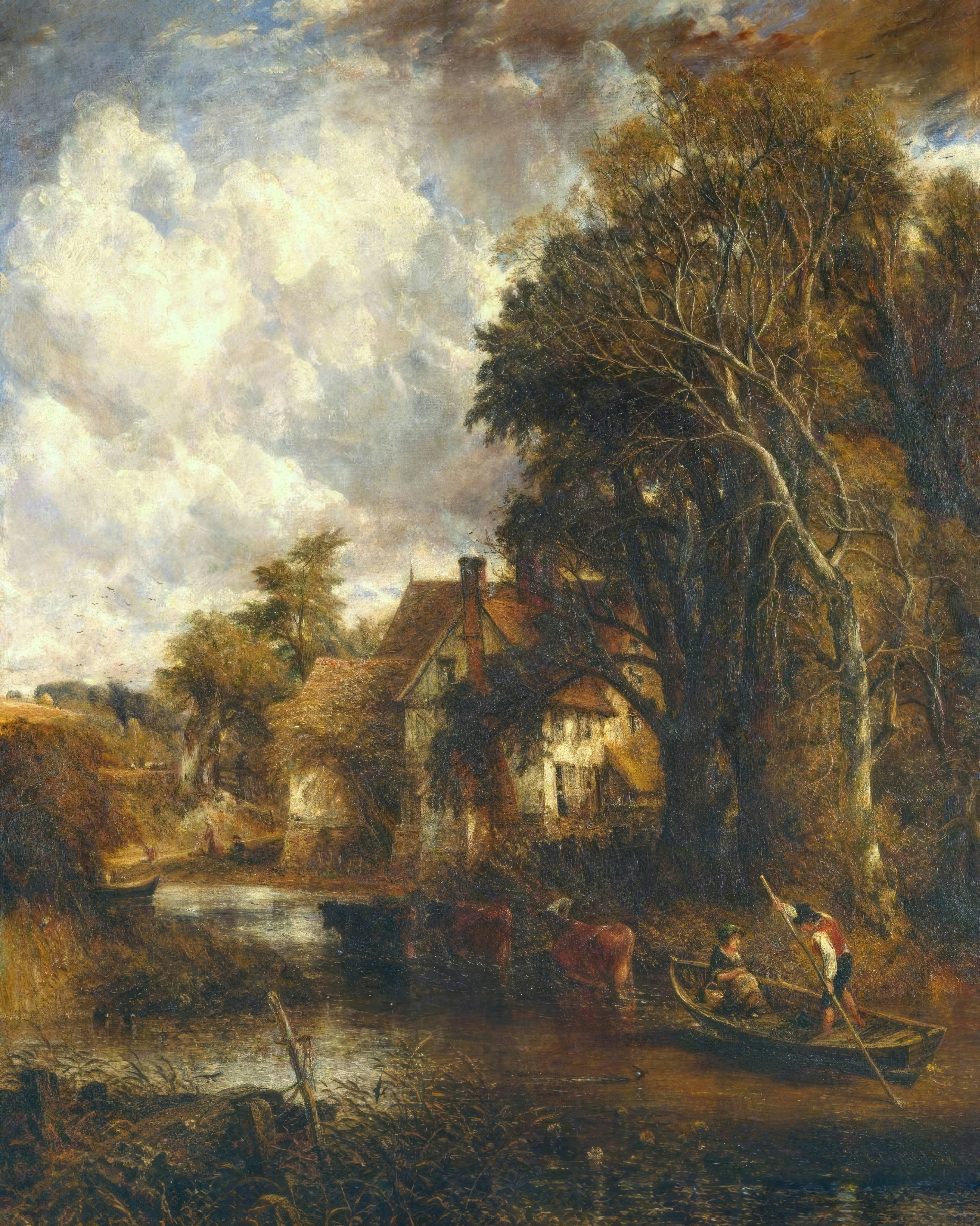 A farmhouse by a river under tall trees, with cattle in the water.