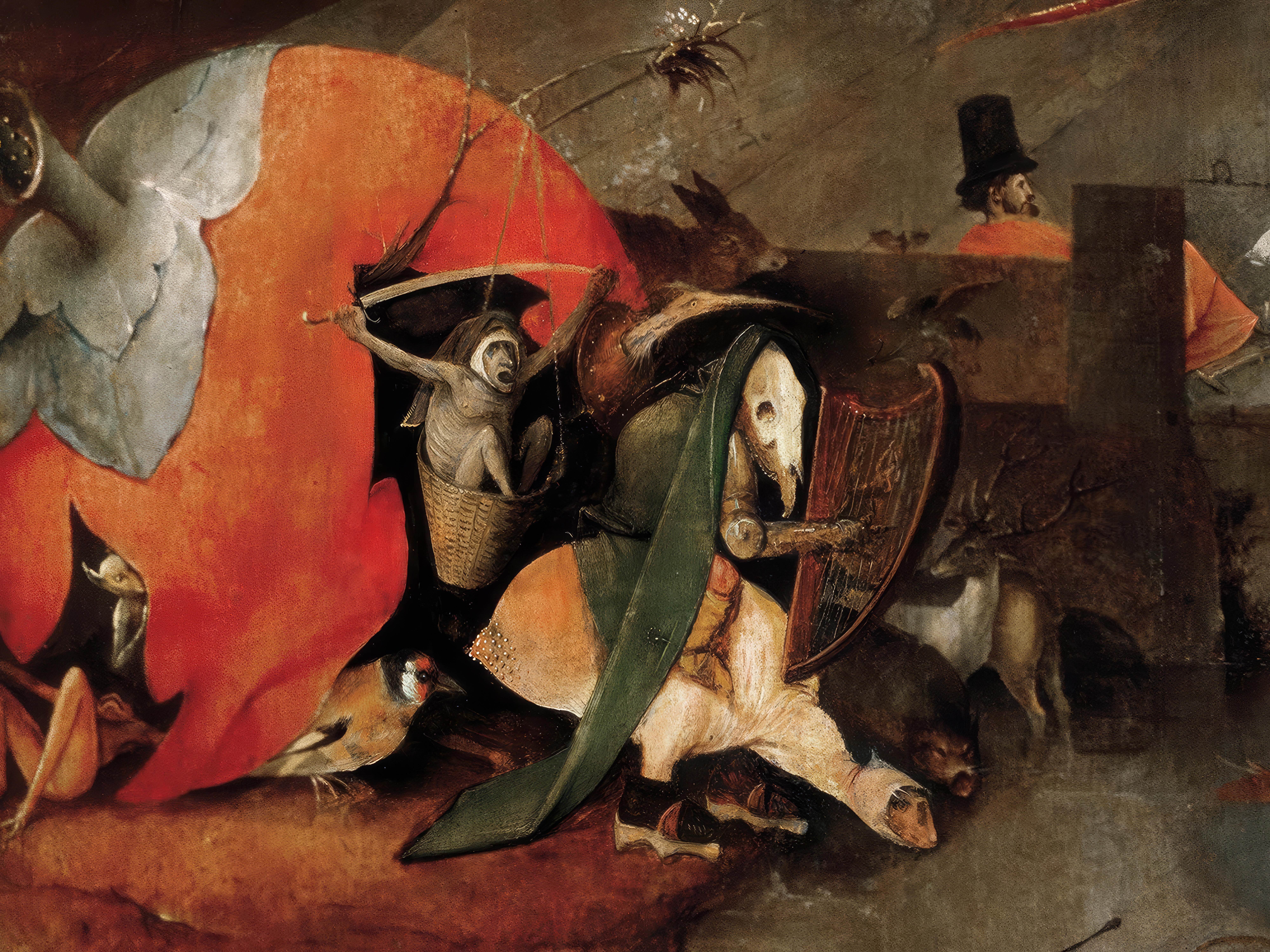 A rider in a green cloak on a strange beast carrying a basket, beside a large red shape and a small goldfinch, in the lower left of the centre panel; detail of Bosch's Temptation of Saint Anthony.