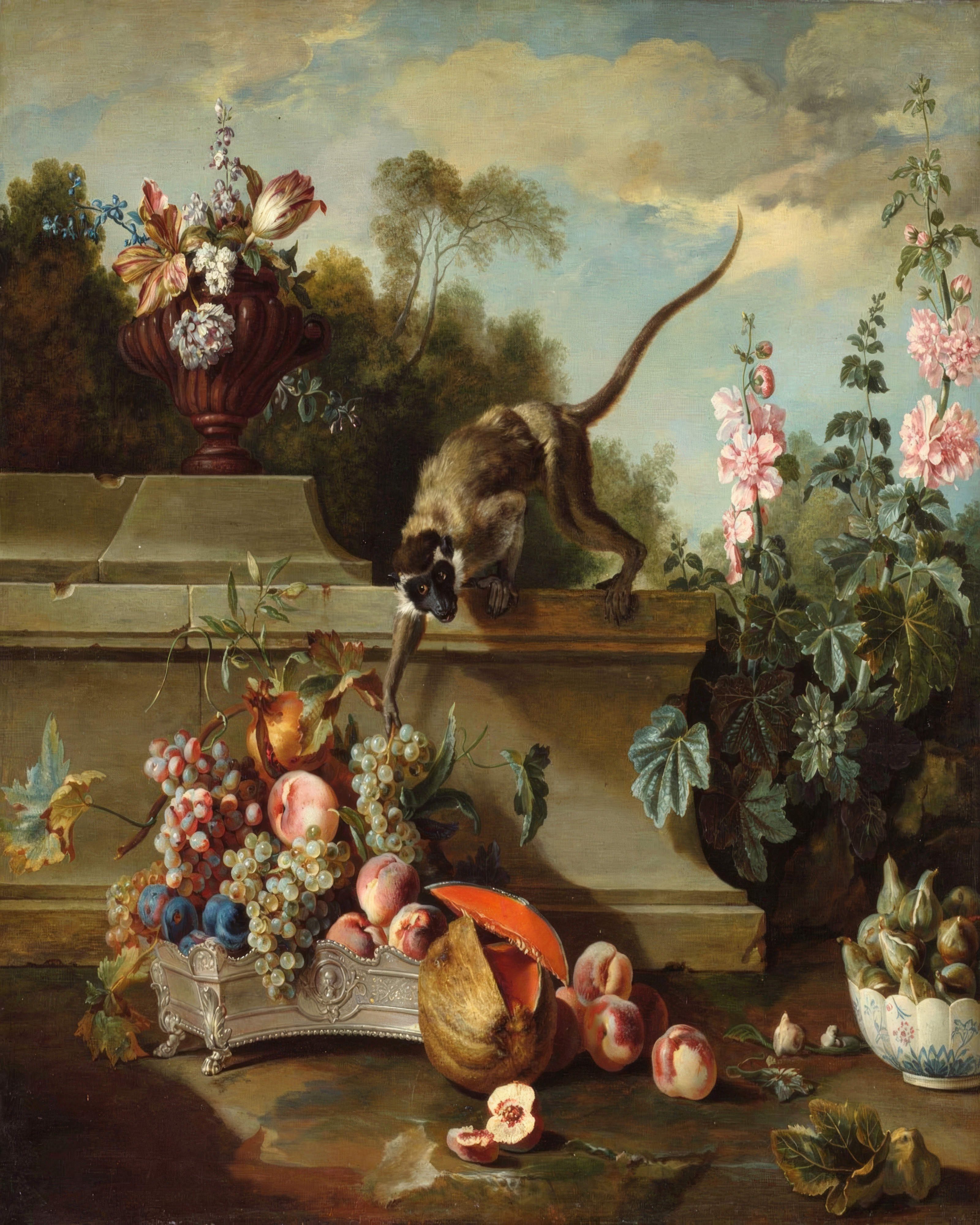 A monkey on a stone ledge reaches for a peach among fruit and flowers.