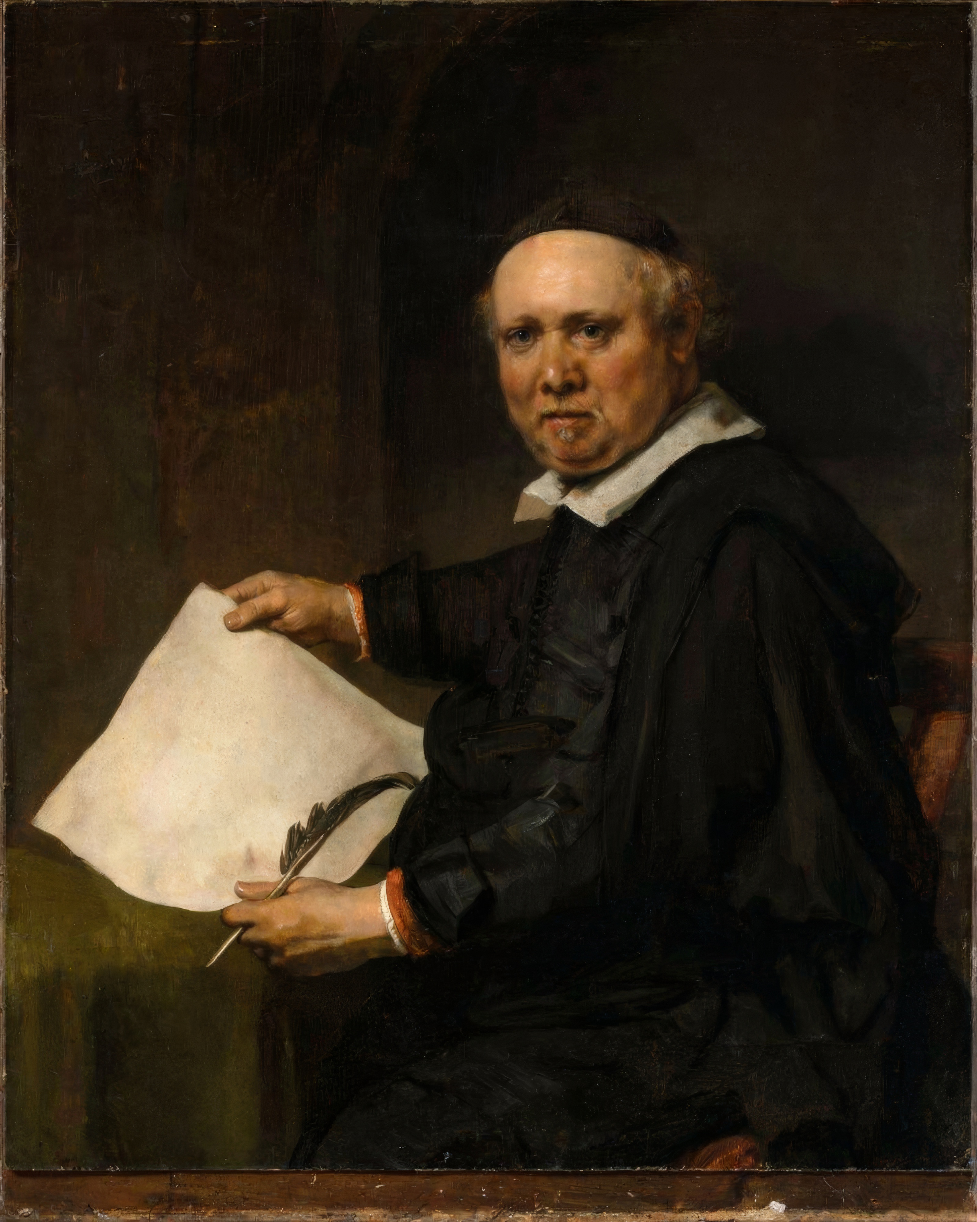An older man in dark clothes sits in shadow, his face and hands lit, holding a pen and paper.