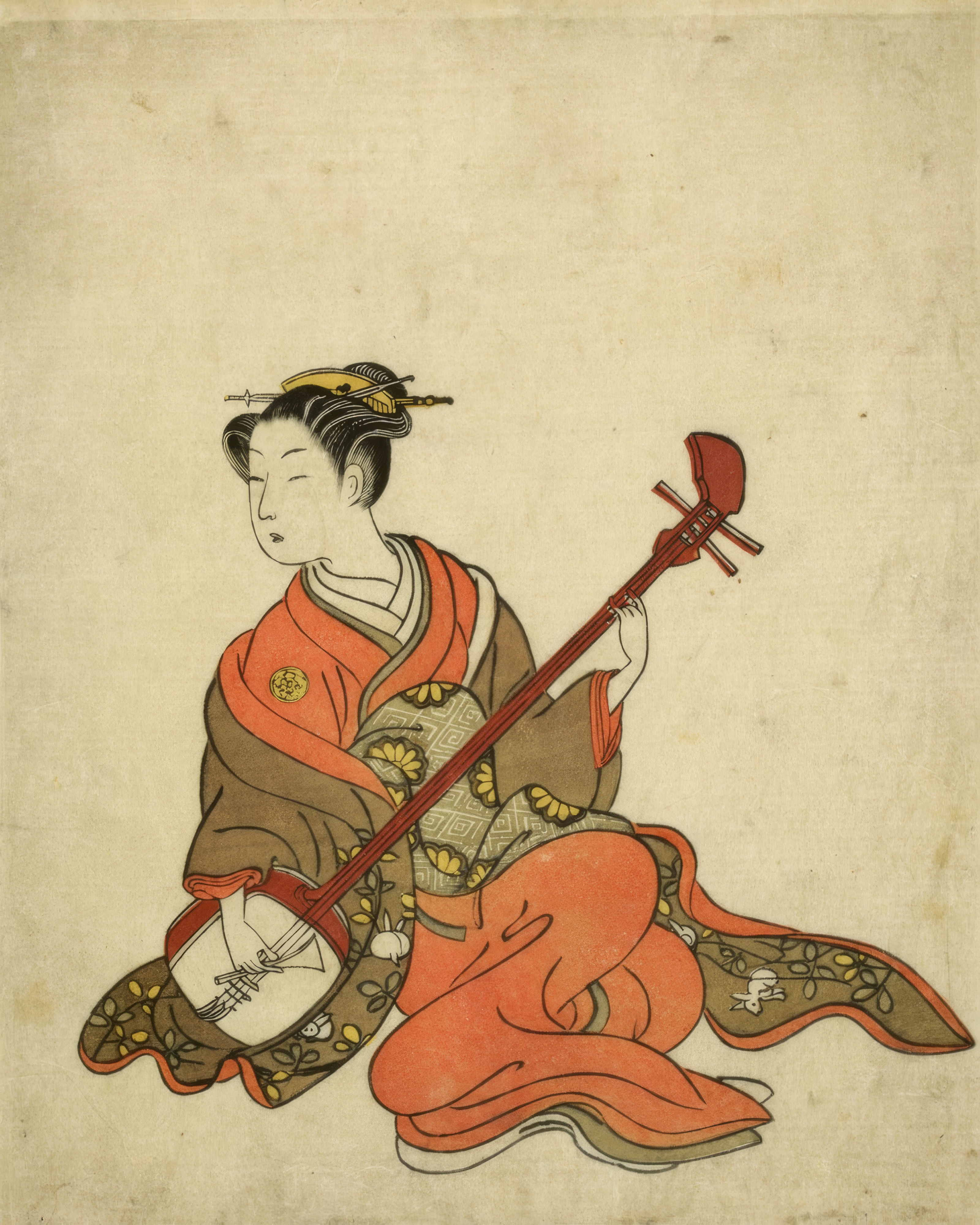 A woman plays the shamisen, a three stringed instrument, in a patterned kimono.