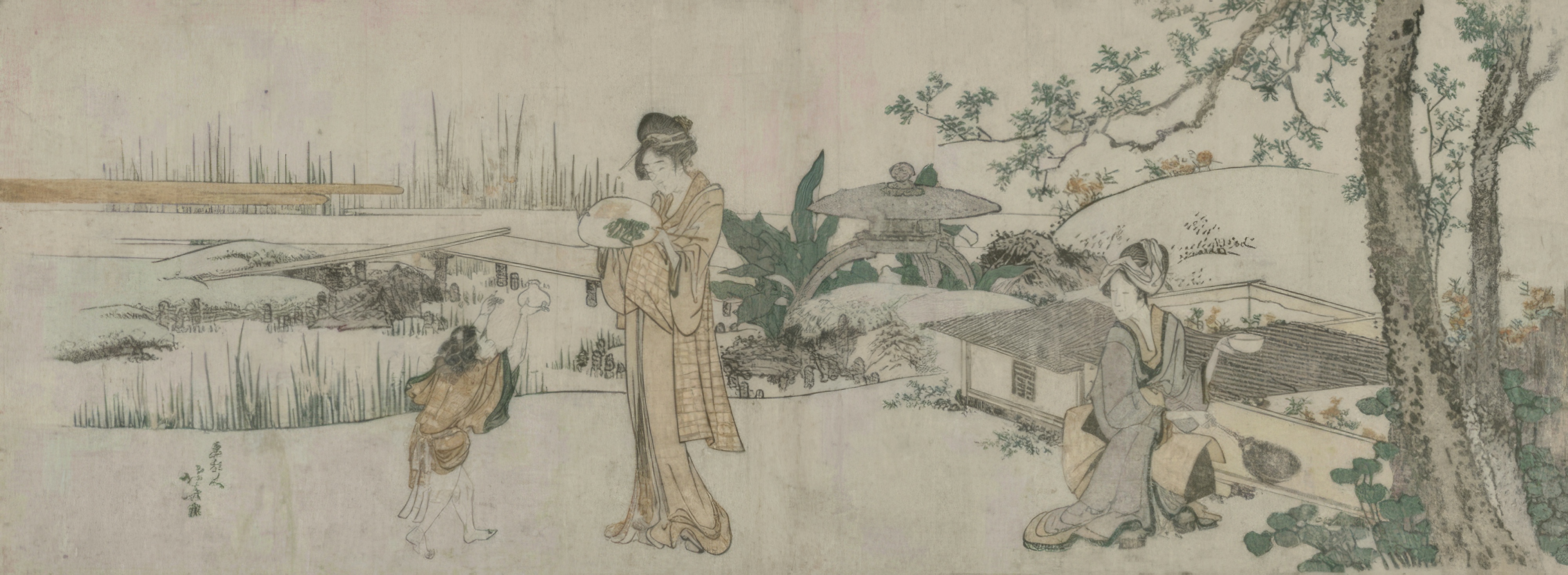 Two women and a small child watch goldfish swimming in a tank.