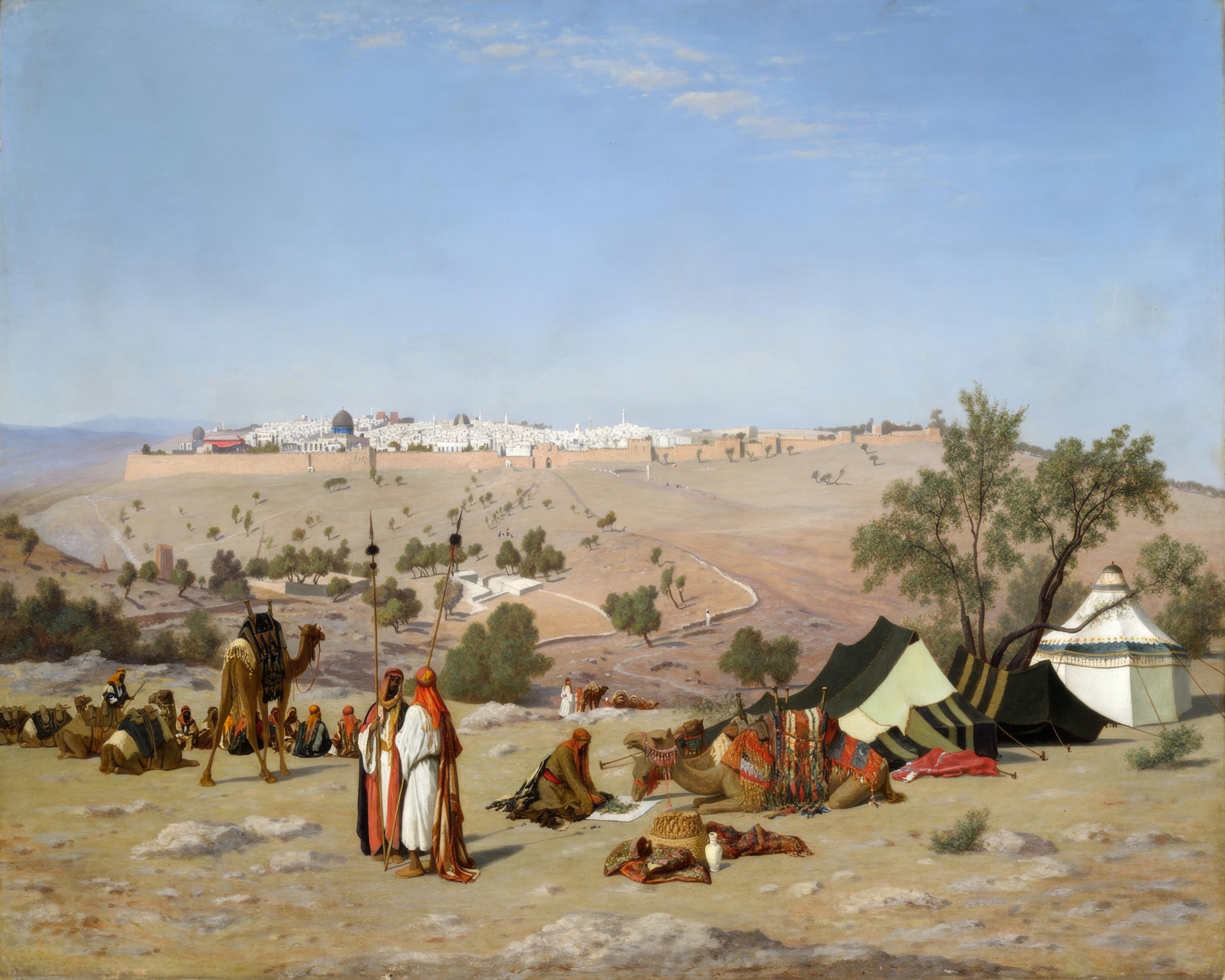 The rooftops and domes of Jerusalem spread out in golden light, seen from the Mount of Olives.