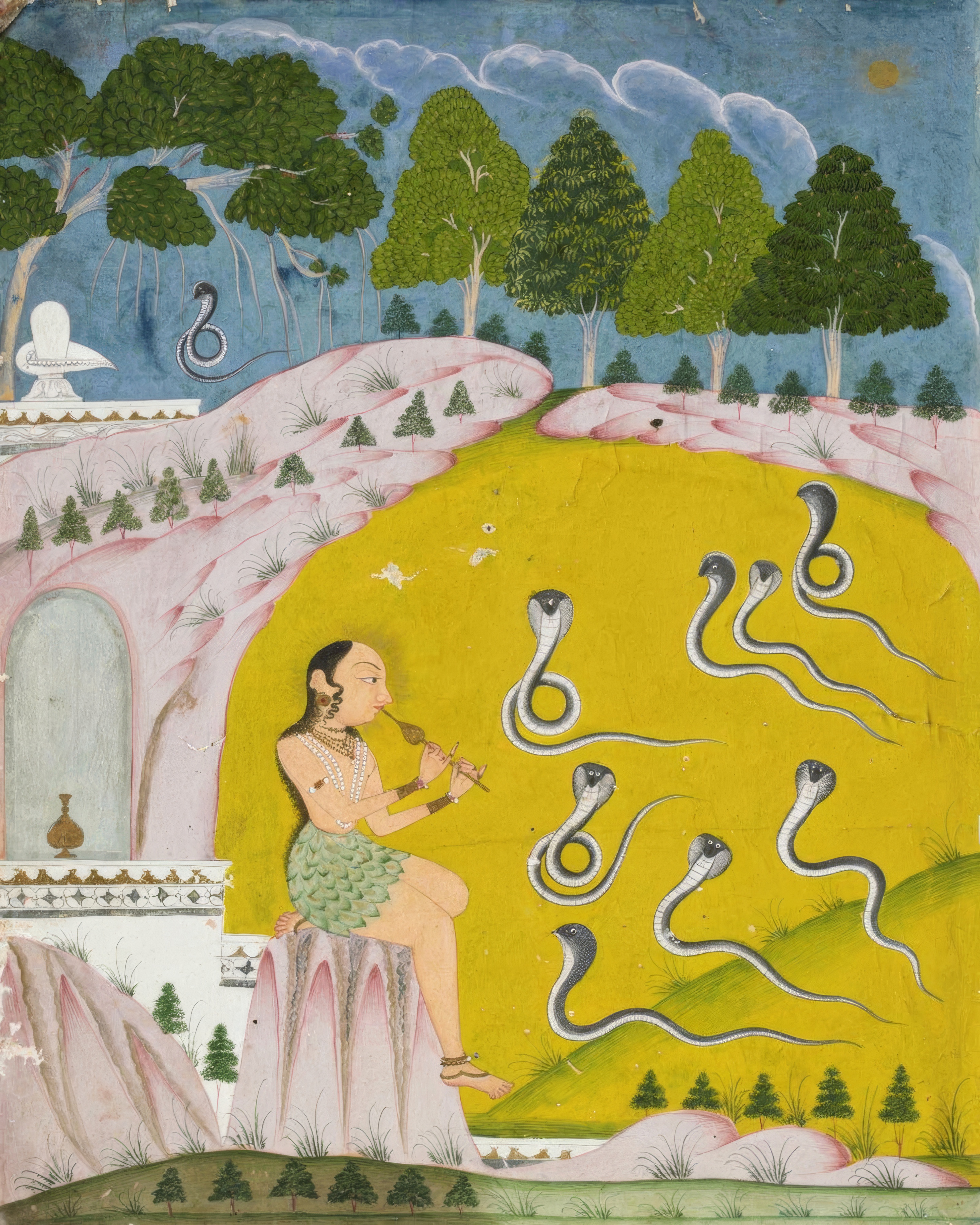 A woman sits alone in a landscape, charming snakes with music.
