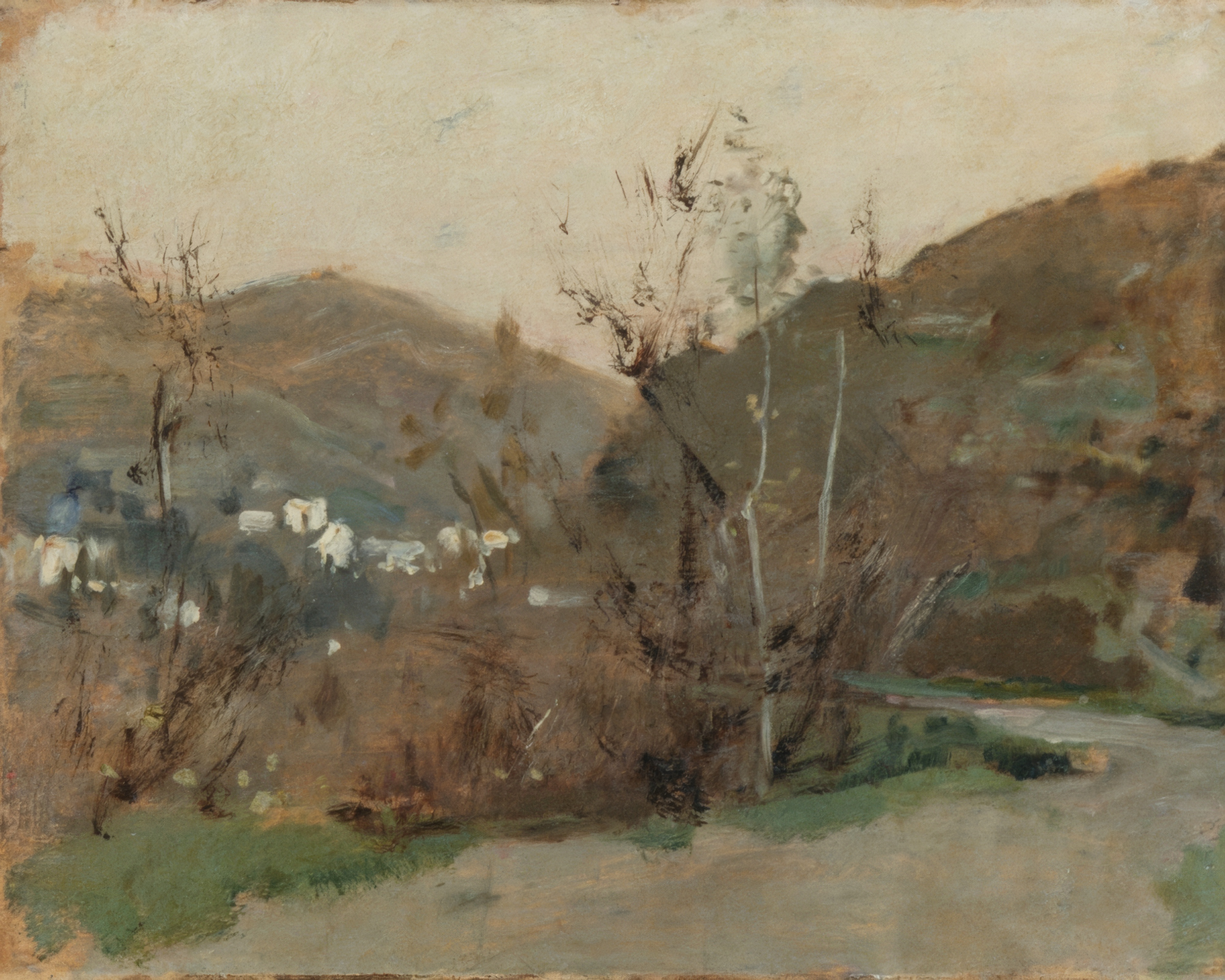 A low Spanish landscape under a wide, pale, sun-bleached sky.