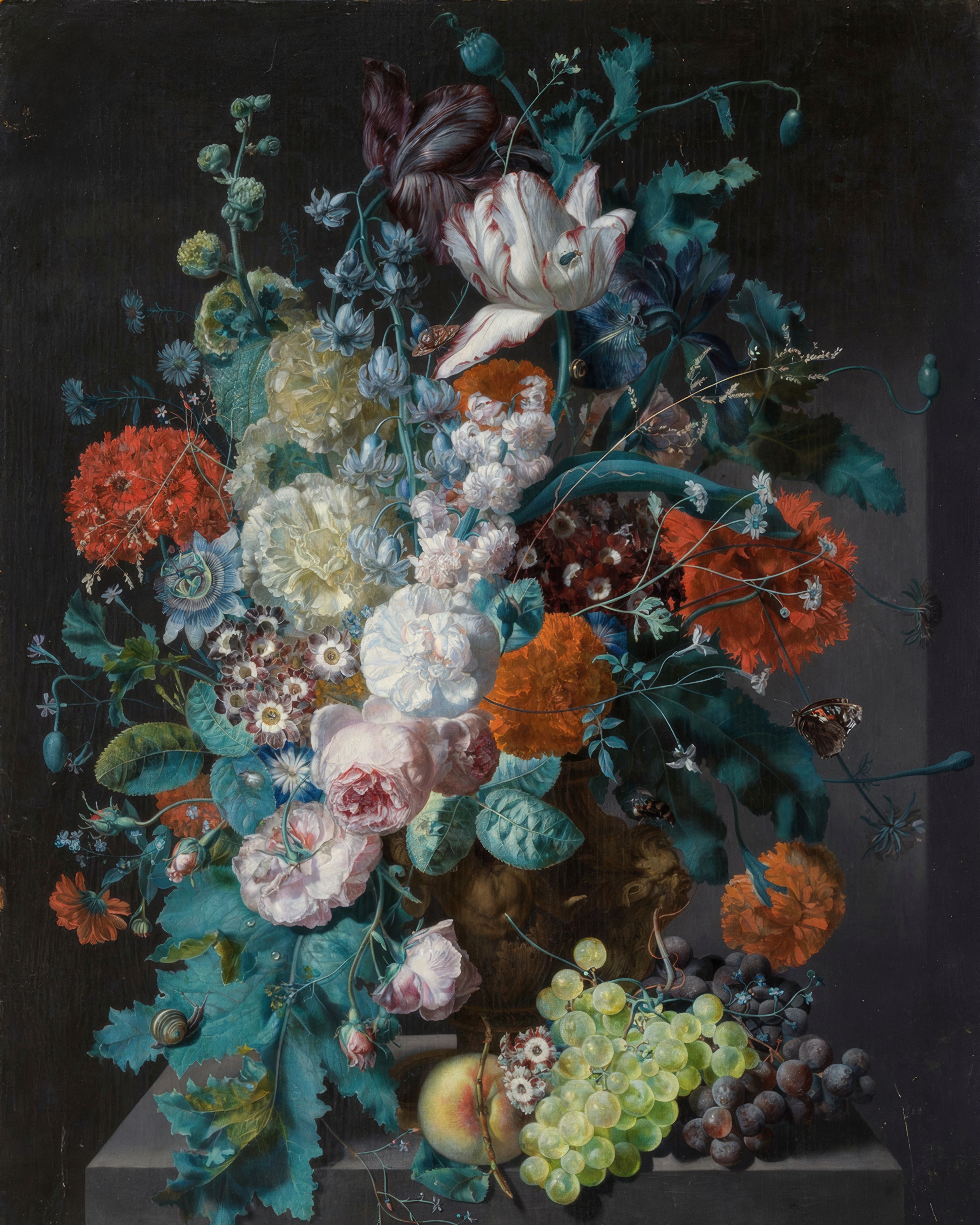 A big bouquet of tulips, roses and other flowers in a stone urn on a ledge, with a bird’s nest.